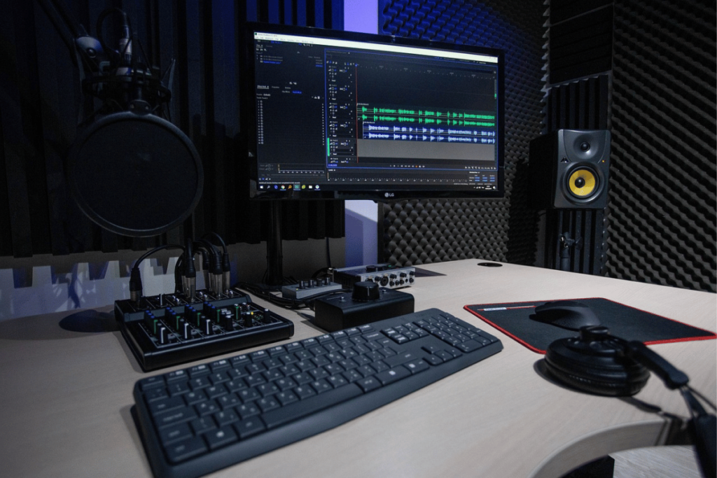 Professional audio recording setup with microphone and mixer.