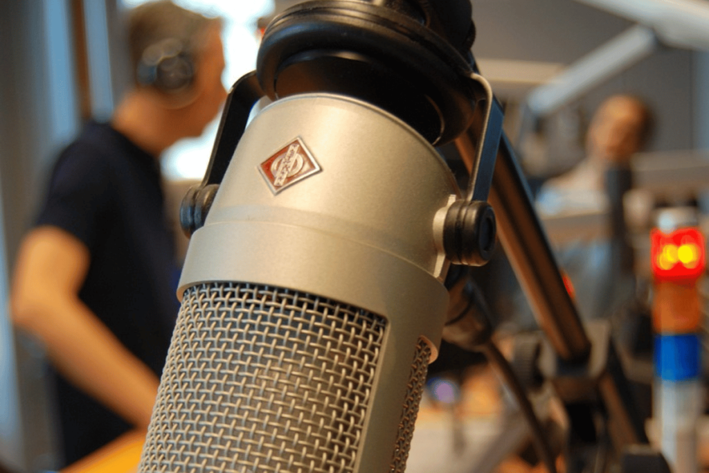 Professional microphone in a studio setting with a blurred background.