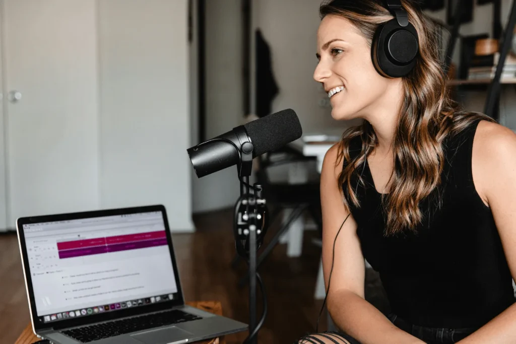 Woman podcasting with professional microphone.