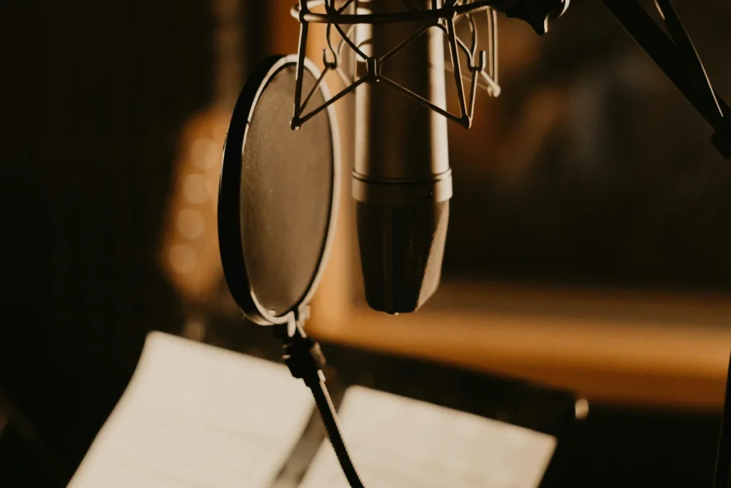 Professional studio microphone with a pop filter set up for recording sessions.