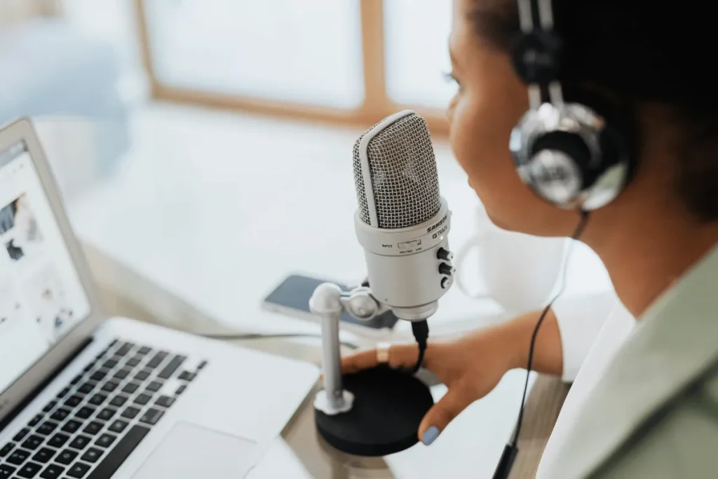 Silver Samson studio mic near laptop.