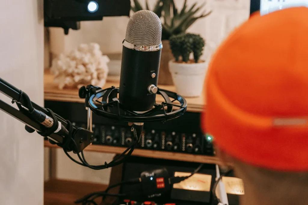 Close-up of a podcast microphone setup in studio.