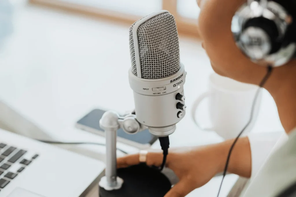 Podcasting microphone setup with laptop.