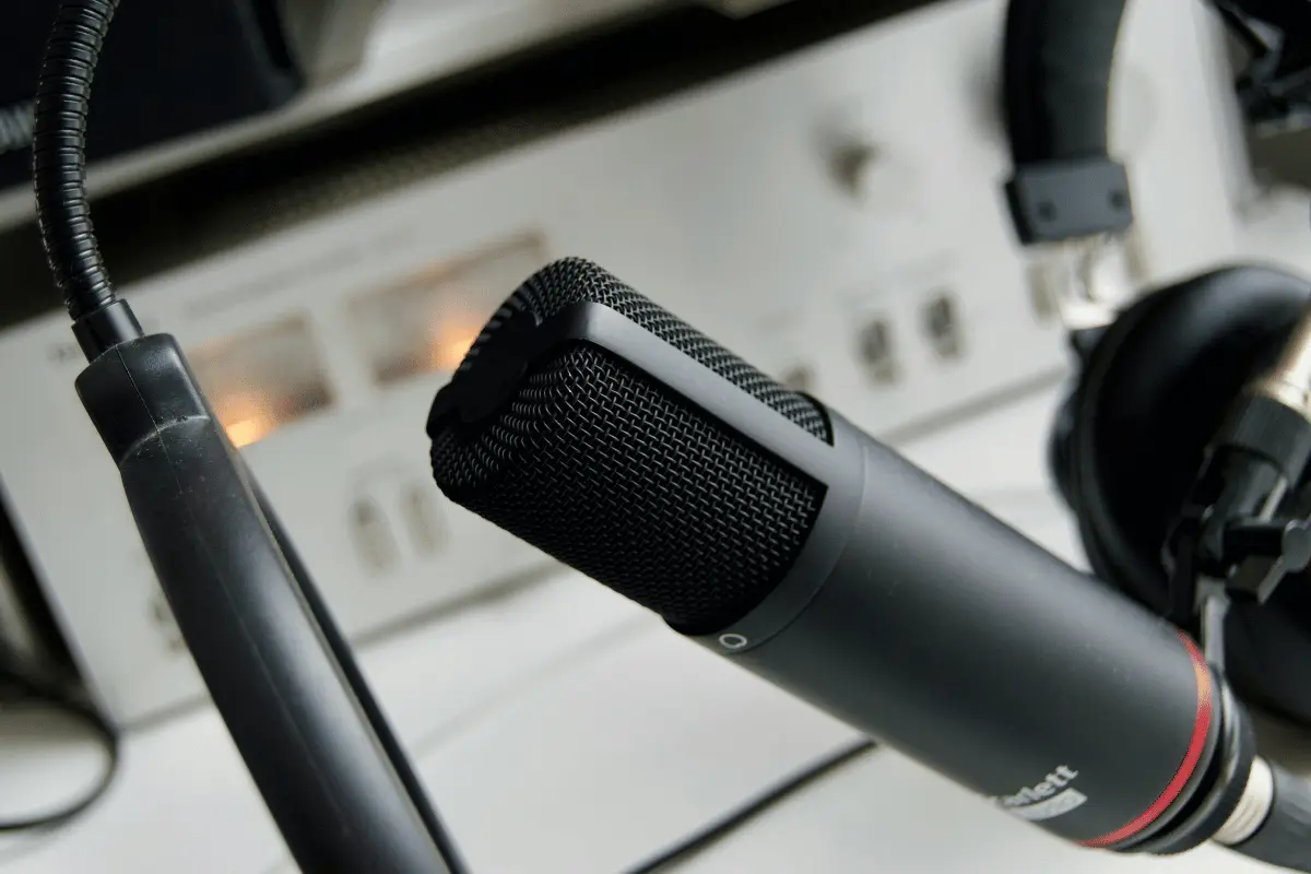 Recording studio microphone and nearby headphones.