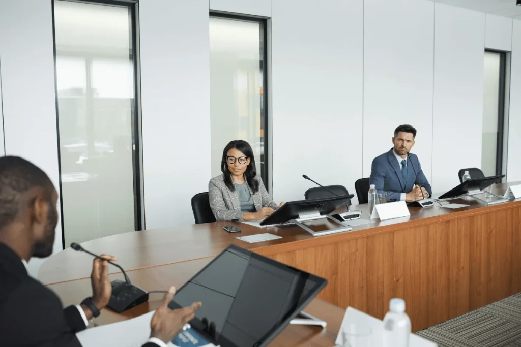 Corporate team discussing at a conference meeting.