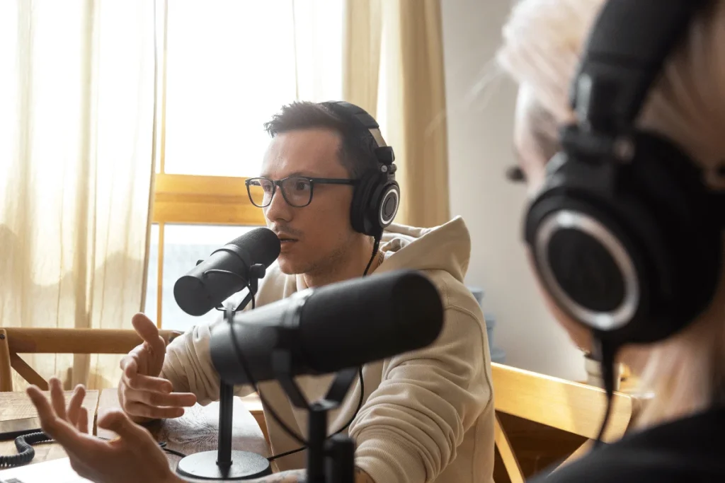 Man recording podcast with professional mic.