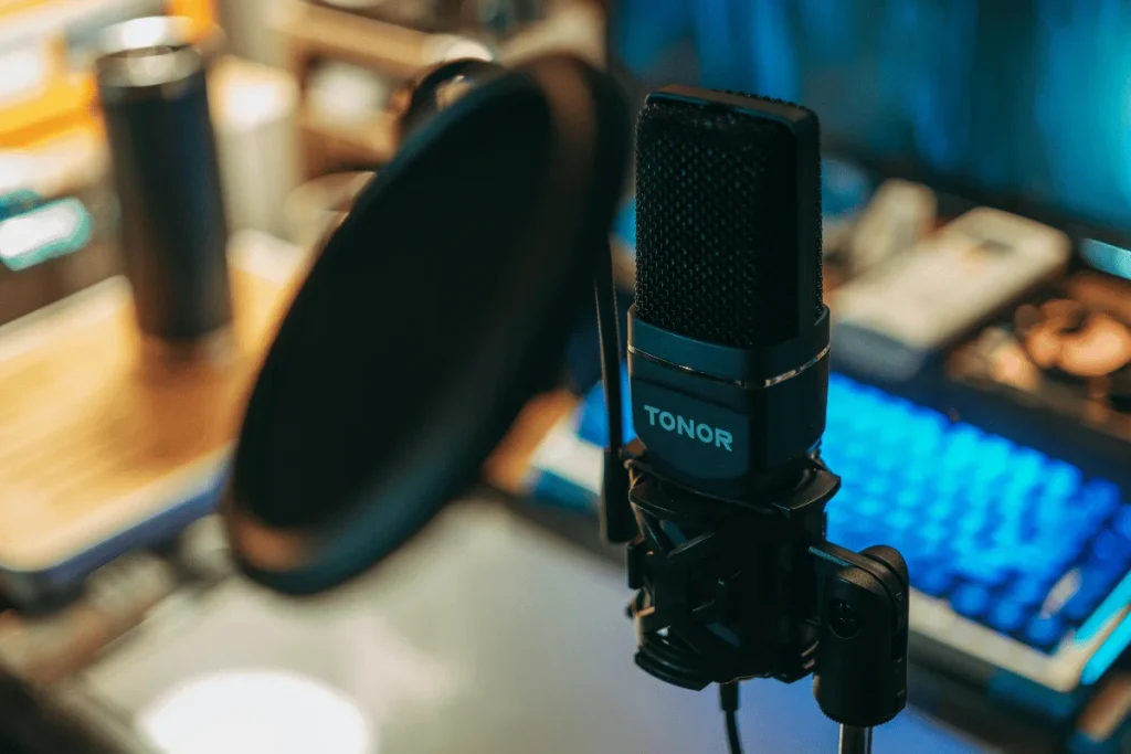 Close-up of Tonor microphone with pop filter.